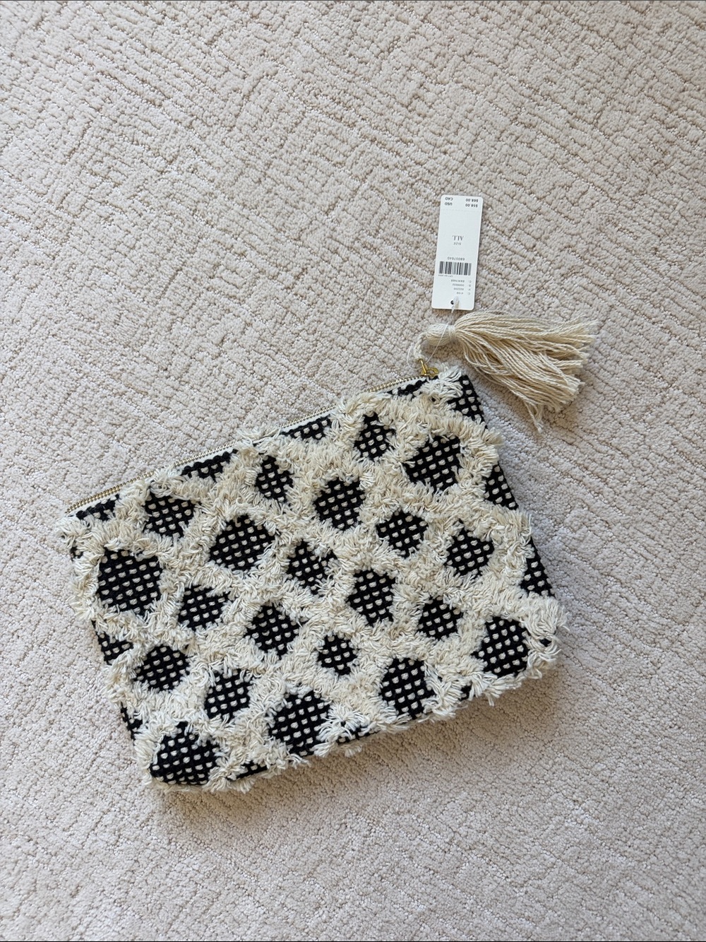 Anthropologie clutch bag with waterproof interior pockets